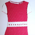 I made this out of fabric and glitter glue. I had alot of fun making it and I want to be a fashion designer. I am 11 years old.